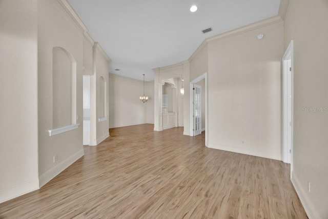 5556 Vintage View Blvd, Lakeland, FL 33812 - unfurnished room featuring light wood-type flooring, baseboards, recessed lighting, arched walkways, and crown molding