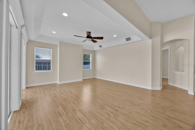5556 Vintage View Blvd, Lakeland, FL 33812 - empty room with a ceiling fan, light wood finished floors, baseboards, recessed lighting, and arched walkways
