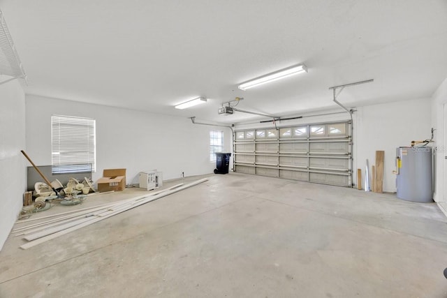 5556 Vintage View Blvd, Lakeland, FL 33812 - garage featuring water heater and a garage door opener