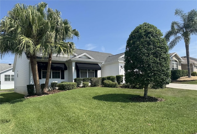 2530 Hanlon Ter, The Villages, FL 32162 - obstructed view of property featuring a front lawn
