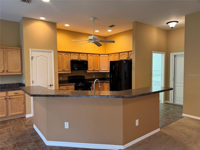 2530 Hanlon Ter, The Villages, FL 32162 - kitchen featuring black appliances, dark countertops, a sink, baseboards, and a towering ceiling