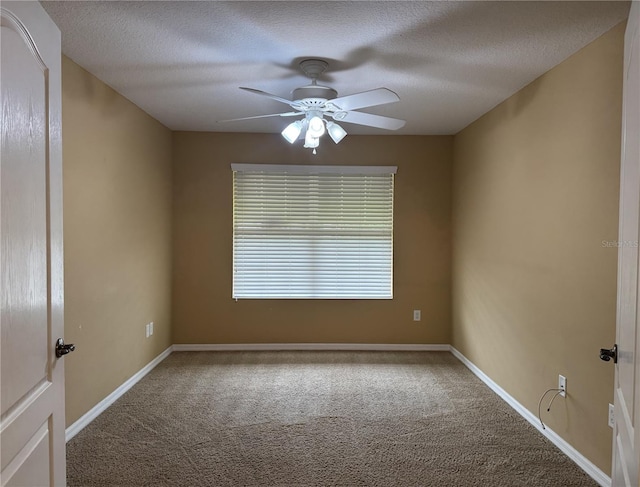 2530 Hanlon Ter, The Villages, FL 32162 - unfurnished room with carpet flooring, ceiling fan, a textured ceiling, and baseboards