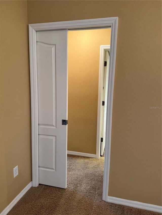2530 Hanlon Ter, The Villages, FL 32162 - hallway featuring carpet and baseboards