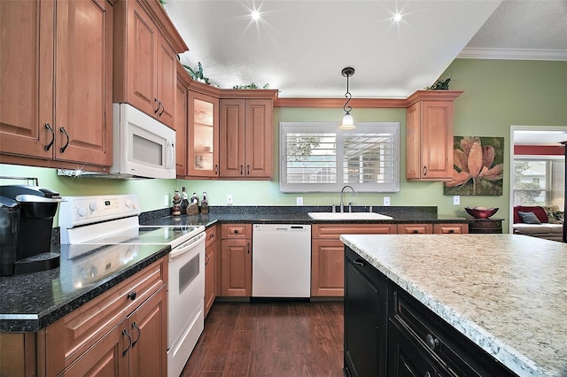 215 Chula Vista Ave, The Villages, FL 32159 - kitchen with white appliances, a sink, crown molding, dark wood-style floors, and decorative light fixtures