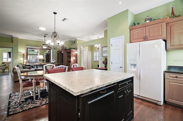 215 Chula Vista Ave, The Villages, FL 32159 - kitchen with white fridge with ice dispenser, a chandelier, crown molding, dark wood-style floors, and a kitchen island