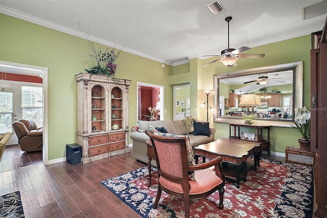 215 Chula Vista Ave, The Villages, FL 32159 - dining space with a ceiling fan, crown molding, wood finished floors, baseboards, and a textured ceiling