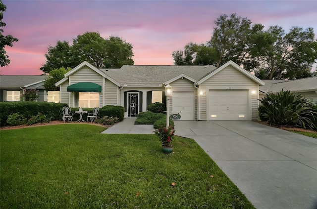 215 Chula Vista Ave, The Villages, FL 32159 - single story home with concrete driveway, a yard, an attached garage, and roof with shingles