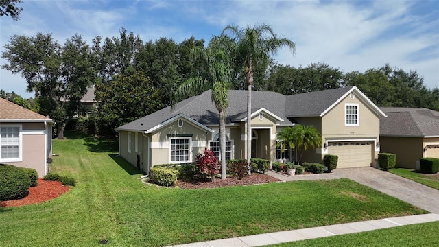 4239 Fawn Meadows Cir, Clermont, FL 34711 - view of front of house with driveway, a front lawn, stucco siding, and a garage