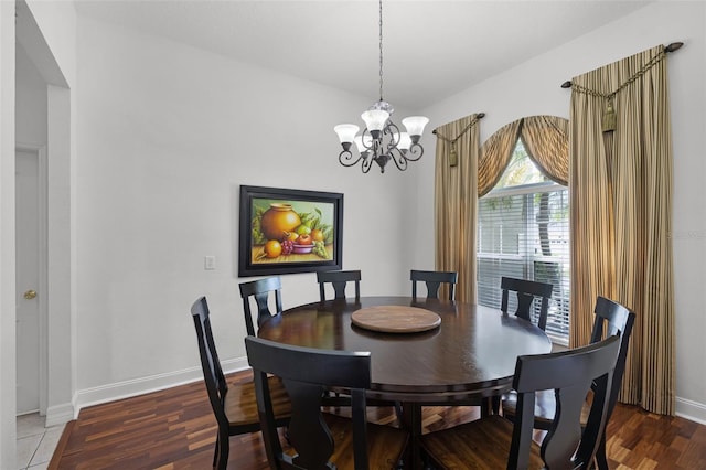 4239 Fawn Meadows Cir, Clermont, FL 34711 - dining area with a chandelier, baseboards, and wood finished floors