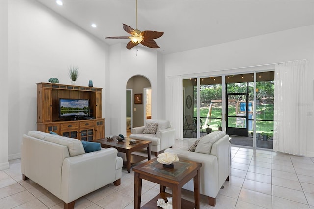 4239 Fawn Meadows Cir, Clermont, FL 34711 - living area featuring arched walkways, a ceiling fan, recessed lighting, light tile patterned flooring, and vaulted ceiling