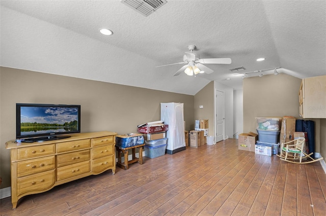 4239 Fawn Meadows Cir, Clermont, FL 34711 - bonus room with lofted ceiling, a textured ceiling, ceiling fan, wood finished floors, and baseboards
