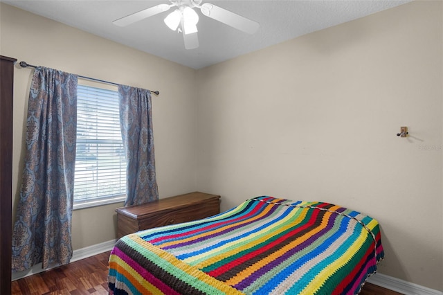 4239 Fawn Meadows Cir, Clermont, FL 34711 - bedroom featuring baseboards, wood finished floors, and a ceiling fan