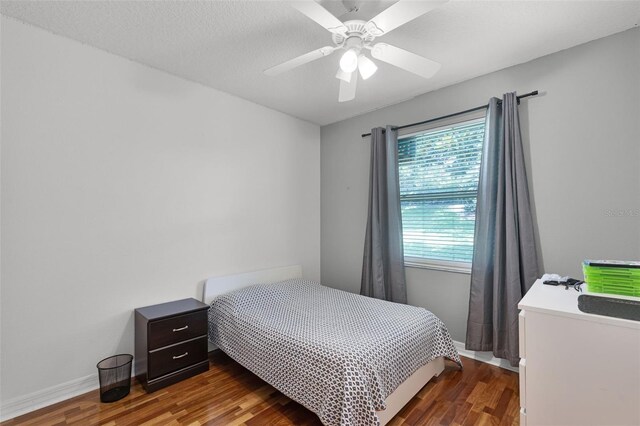 4239 Fawn Meadows Cir, Clermont, FL 34711 - bedroom featuring wood finished floors, baseboards, and a ceiling fan