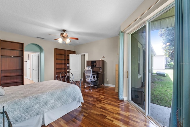 4239 Fawn Meadows Cir, Clermont, FL 34711 - bedroom featuring access to outside, wood finished floors, baseboards, arched walkways, and a ceiling fan