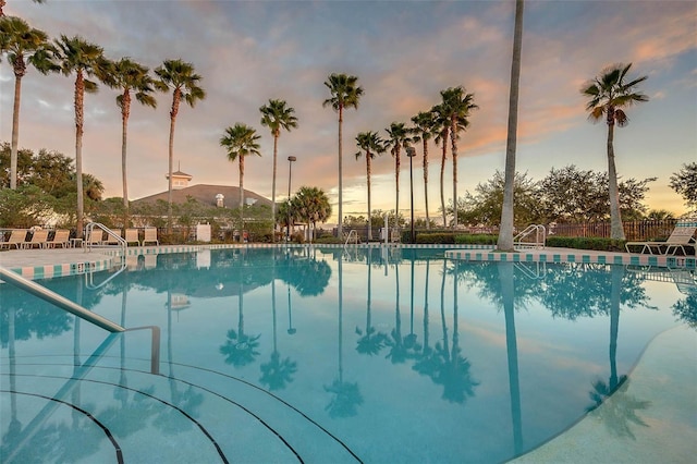 4239 Fawn Meadows Cir, Clermont, FL 34711 - pool at dusk with a community pool