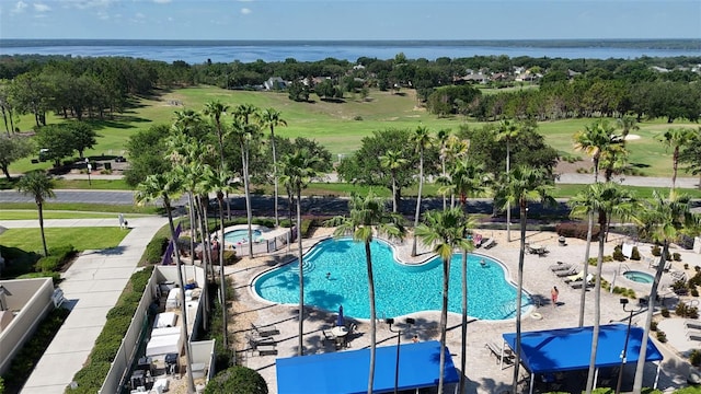 4239 Fawn Meadows Cir, Clermont, FL 34711 - community pool with a water view, view of golf course, and a community hot tub