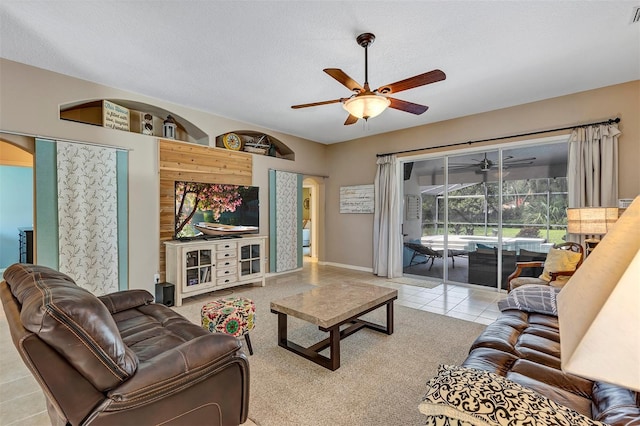 34231 Shadewood Cir, Leesburg, FL 34788 - tiled living area with a ceiling fan, arched walkways, and baseboards