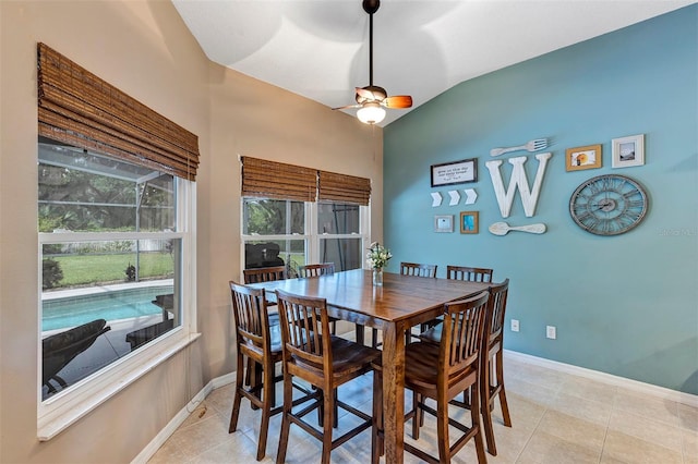 34231 Shadewood Cir, Leesburg, FL 34788 - dining space featuring ceiling fan, light tile patterned flooring, baseboards, and lofted ceiling