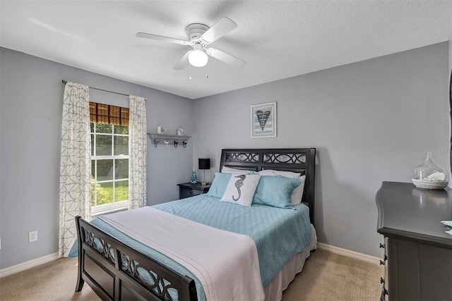 34231 Shadewood Cir, Leesburg, FL 34788 - bedroom with carpet, baseboards, ceiling fan, and a textured ceiling
