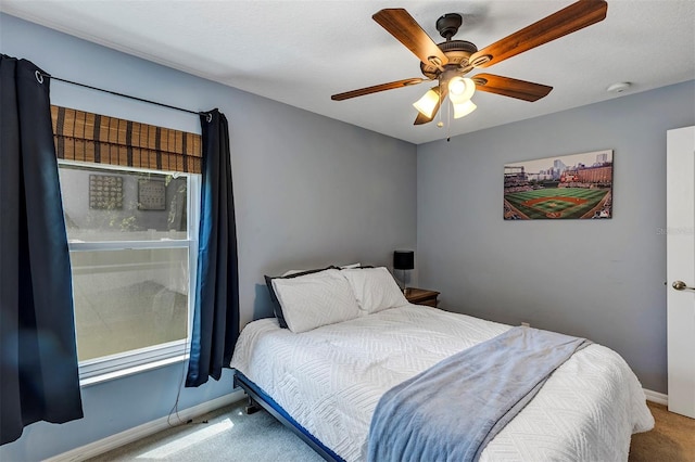 34231 Shadewood Cir, Leesburg, FL 34788 - carpeted bedroom featuring baseboards and ceiling fan