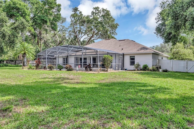 34231 Shadewood Cir, Leesburg, FL 34788 - rear view of house featuring stucco siding and glass enclosure