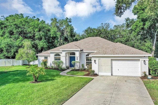 34231 Shadewood Cir, Leesburg, FL 34788 - ranch-style home featuring roof with shingles, concrete driveway, stucco siding, and a garage