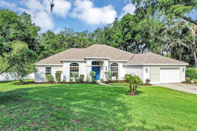 34231 Shadewood Cir, Leesburg, FL 34788 - ranch-style house featuring an attached garage, concrete driveway, a front yard, and roof with shingles
