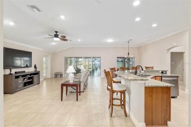 3097 Bureau Path, The Villages, FL 32163 - kitchen featuring dishwasher, arched walkways, a sink, ceiling fan, and vaulted ceiling
