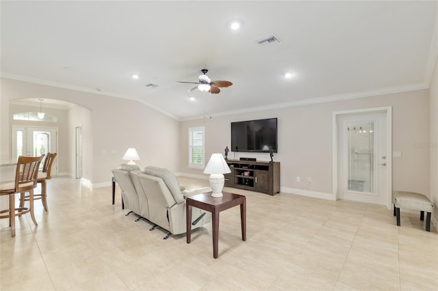 3097 Bureau Path, The Villages, FL 32163 - living room with crown molding, arched walkways, a ceiling fan, lofted ceiling, and baseboards