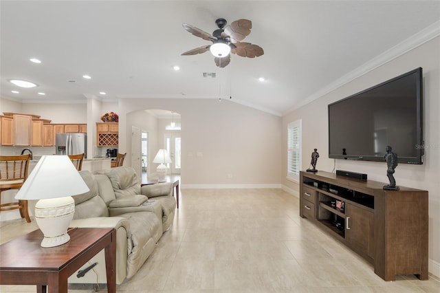 3097 Bureau Path, The Villages, FL 32163 - living area with arched walkways, ornamental molding, ceiling fan, baseboards, and healthy amount of natural light