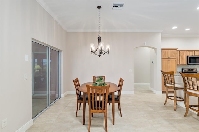 3097 Bureau Path, The Villages, FL 32163 - dining area with arched walkways, crown molding, a chandelier, light tile patterned floors, and recessed lighting
