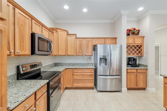 3097 Bureau Path, The Villages, FL 32163 - kitchen with appliances with stainless steel finishes, crown molding, decorative backsplash, light stone counters, and recessed lighting