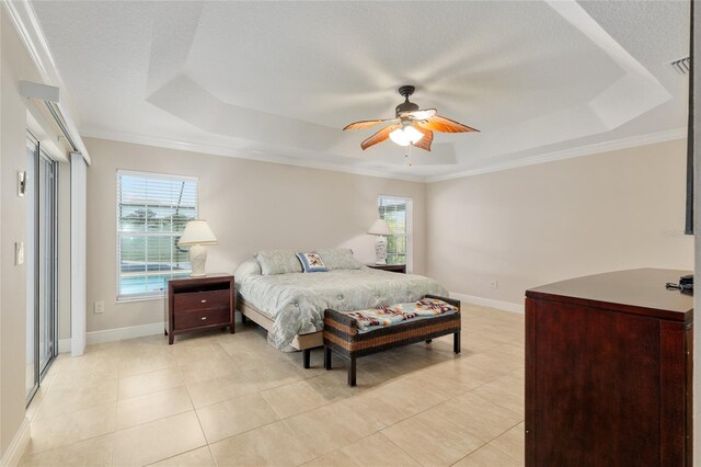 3097 Bureau Path, The Villages, FL 32163 - bedroom with a raised ceiling, light tile patterned flooring, ornamental molding, baseboards, and a textured ceiling
