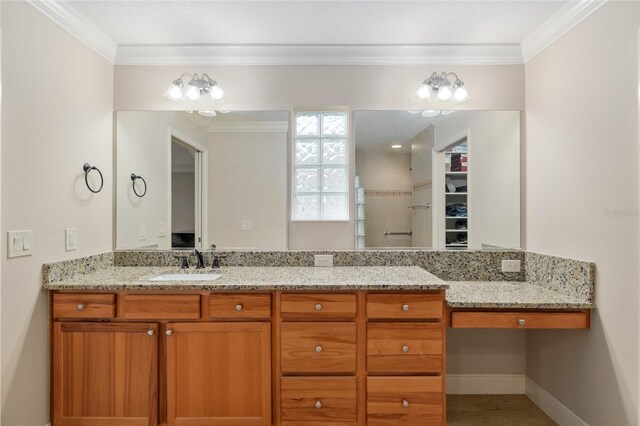 3097 Bureau Path, The Villages, FL 32163 - bathroom featuring crown molding, vanity, baseboards, and a spacious closet