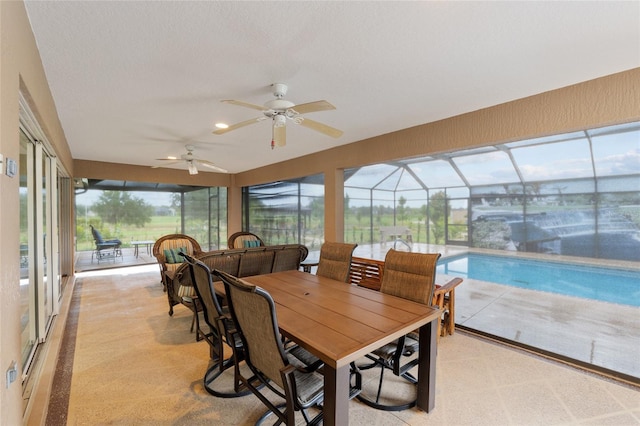 3097 Bureau Path, The Villages, FL 32163 - sunroom with a ceiling fan, outdoor dining area, and plenty of natural light