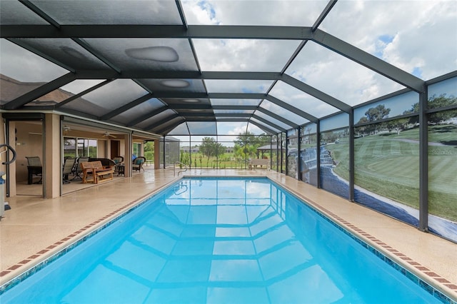 3097 Bureau Path, The Villages, FL 32163 - swimming pool with a patio, glass enclosure, and a ceiling fan
