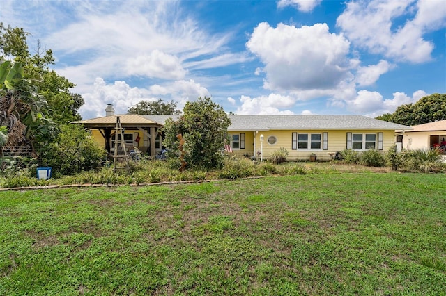 101 Lakeshore Blvd, Saint Cloud, FL 34769 - single story home with a front lawn and a chimney