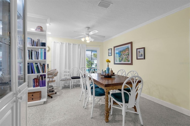 101 Lakeshore Blvd, Saint Cloud, FL 34769 - dining space featuring a textured ceiling, a ceiling fan, ornamental molding, and baseboards