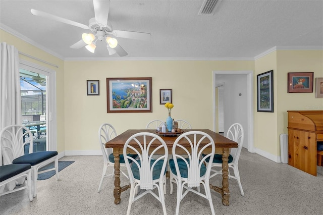 101 Lakeshore Blvd, Saint Cloud, FL 34769 - dining room with baseboards, speckled floor, crown molding, ceiling fan, and a textured ceiling