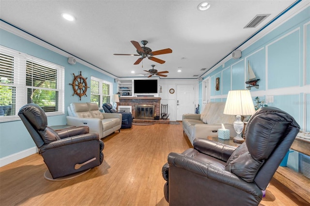 101 Lakeshore Blvd, Saint Cloud, FL 34769 - living room with recessed lighting, a ceiling fan, light wood-type flooring, a fireplace, and baseboards