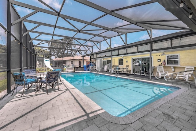 101 Lakeshore Blvd, Saint Cloud, FL 34769 - outdoor pool featuring a water slide, a ceiling fan, a patio, and a lanai