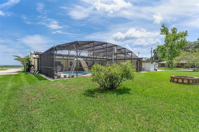 101 Lakeshore Blvd, Saint Cloud, FL 34769 - view of grassy yard with glass enclosure and an outdoor pool