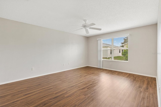 2317 Whisper St, The Villages, FL 32162 - spare room with wood finished floors, ceiling fan, baseboards, and a textured ceiling