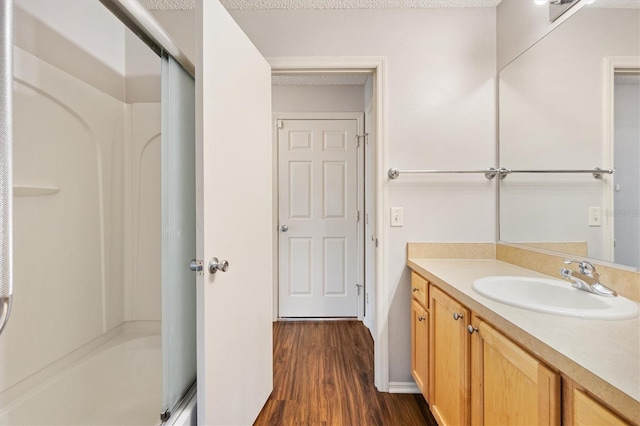 2317 Whisper St, The Villages, FL 32162 - full bath featuring vanity, wood finished floors, and shower / tub combination