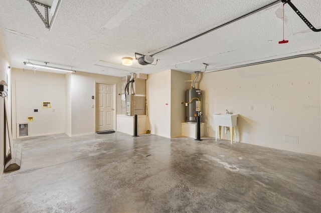 2317 Whisper St, The Villages, FL 32162 - garage with water heater, a garage door opener, heating unit, and a sink
