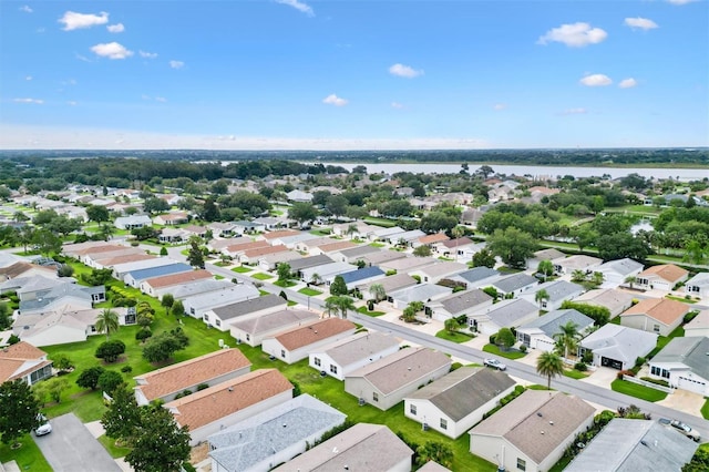 2317 Whisper St, The Villages, FL 32162 - aerial overview of property's location with a nearby body of water and nearby suburban area