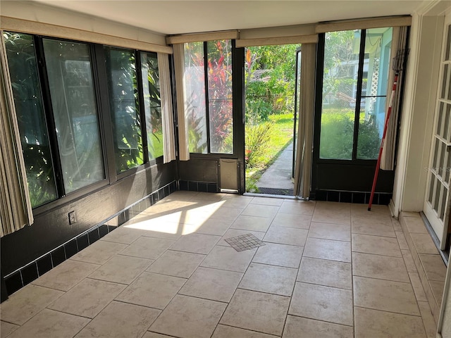 11812 Watts Ct, Tavares, FL 32778 - unfurnished sunroom featuring healthy amount of natural light