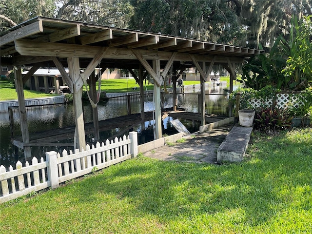 11812 Watts Ct, Tavares, FL 32778 - dock with a lawn and a water view