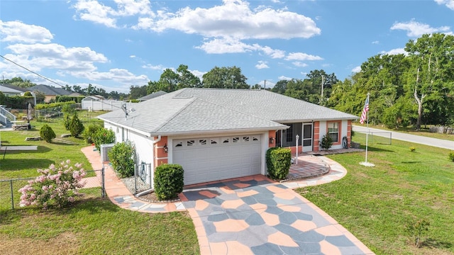 8850 SE 156th St, Summerfield, FL 34491 - ranch-style house featuring driveway, an attached garage, roof with shingles, and a sunroom