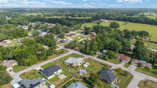 8850 SE 156th St, Summerfield, FL 34491 - aerial view of property and surrounding area with nearby suburban area
